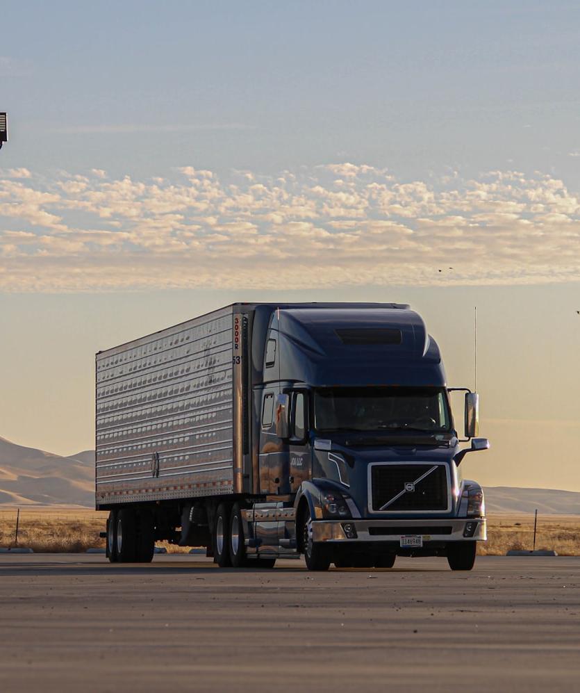 black truck on road during daytime